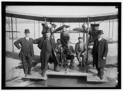 RICHARDSON TANDEM BIPLANE HYDROPLANE ON POTOMAC, APRIL, 1916. GEORGE A. GRAY AT CONTROLS. AT LEFT AND RIGHT ARE RICHARDSON BROTHERS WHO BUILT THE PLANE; 2ND FROM LEFT IS THEIR UNCLE, WHOSE IDEA IT WAS