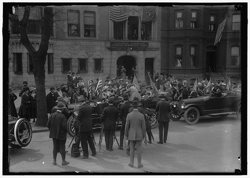 RANKIN, JEANETTE [i.e. Jeannette]. REP. FROM MONTANA, 1917-1919. IN CAR SURROUNDED BY SUFFRAGETTES