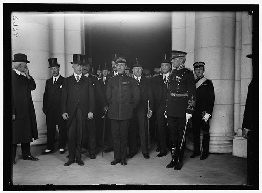 ITALIAN COMMISSION TO U.S. AT CENTER: SEC. LANSING AND H.R.H. FERDINAND DI SAVOIA, PRINCE OF UDINE. COUNT MACCHI DI CELLEN, AMBASSADOR TO U.S. AT REAR, LEFT OF LANSING. BORSARELLI. REAR RIGHT OF UDINE. COL. HART, REAR RIGHT; MARCONI AT LEFT. IN 8775: EURICO ALLIATO
