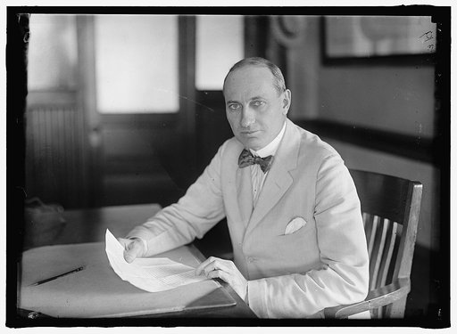 COFFIN, HOWARD EARLE. AT DESK