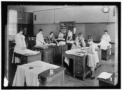 GIRL SCOUTS. WAR SEWING WITH RED CROSS