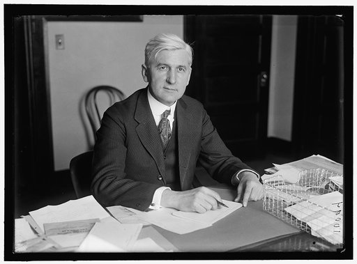 PRICE, OSCAR E. DIRECTOR PUBLICITY, 2ND LIBERTY LOAN. AT DESK