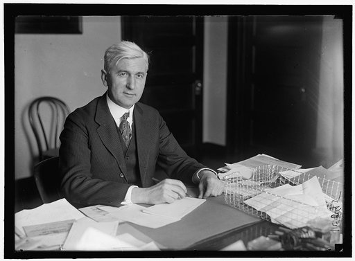 PRICE, OSCAR E. DIRECTOR PUBLICITY, 2ND LIBERTY LOAN. AT DESK