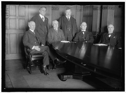 RAILWAY WAGE COMMISSION. CREATED JANUARY 18, 1918 BY DIRECTOR GENERAL OF RAILROADS. SEATED: J.H. COVINGTON; FRANKLIN K. LANE; CHARLES C. McCHORD; WILLIAM R. WILCOX. STANDING: W.A. RYAN; F.W. LEHMAN