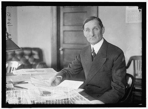 McADOO, WILLIAM GIBBS. SECRETARY OF THE TREASURY, 1913-1921. AT DESK