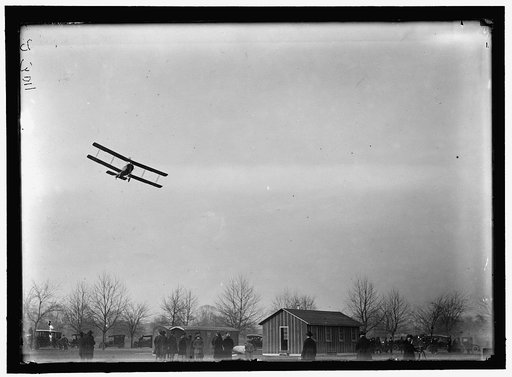 ALLIED AIRCRAFT. DEMONSTRATION AT POLO GROUNDS. COL. CHARLES E. LEE, BRITISH AVIATOR, WITH AVRO TRAINING PLANE DESIGNED BY A.V. ROE OF ENGLAND