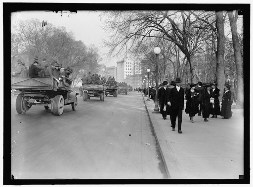 ARMY, U.S. SOLDIERS GOING THROUGH CITY IN TRUCKS AND AUTOS