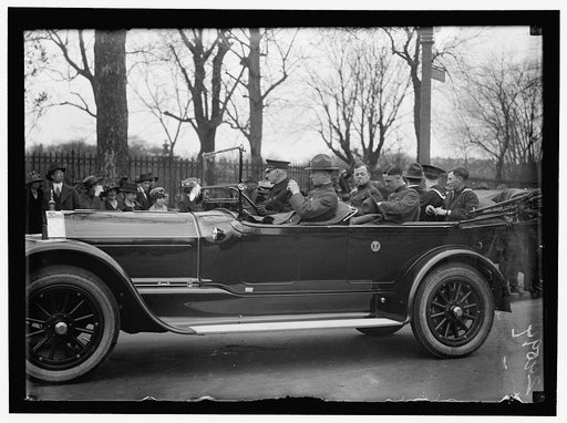 ARMY, U.S. SOLDIERS GOING THROUGH CITY IN TRUCKS AND AUTOS