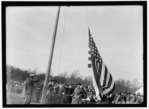 WOMAN'S NATIONAL SERVICE SCHOOL UNDER WOMAN'S SECTION, NAVY LEAGUE. MRS. DANIELS RAISING FLAG