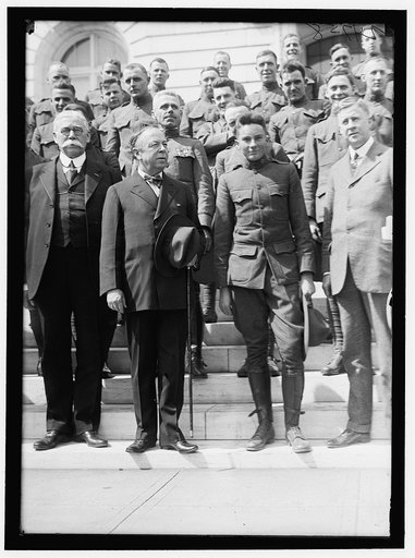 ARMY, U.S. GROUP OF SOLDIERS ON STEPS OF SENATE OFFICE BUILDING WITH SENATORS McNARY, WARREN, CHAMBERLAIN, ?, AND MckELLAR. A SOLDIER IN FRONT OF SENATORS