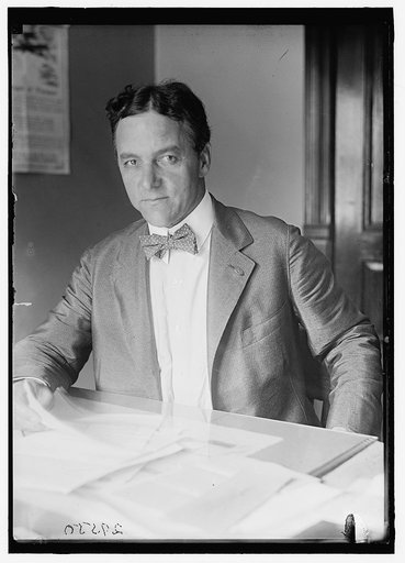 RUSTLING, H.P. AT DESK