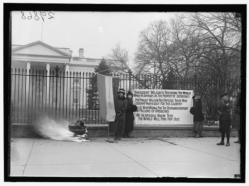 WOMAN SUFFRAGE. BONFIRE ON SIDEWALK BEFORE WHITE HOUSE