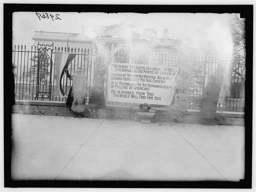 WOMAN SUFFRAGE. BONFIRE ON SIDEWALK BEFORE WHITE HOUSE