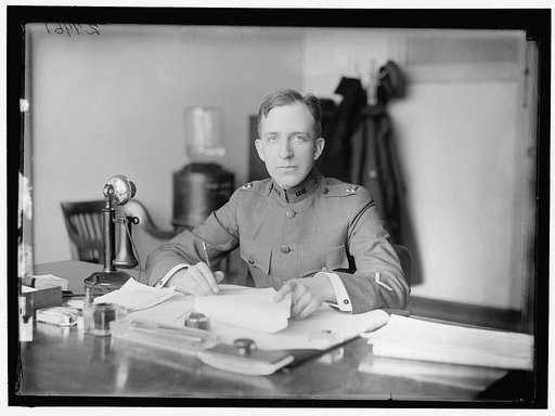 McKELLY. CAPT., U.S.A. AT DESK