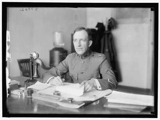 McKELLY. CAPT., U.S.A. AT DESK