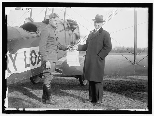 LIBERTY LOANS. CARTER GLASS GIVING VICTORY LOAN CIRCULARS TO LT. BENJAMIN TO DISTRIBUTE BY AIRPLANE