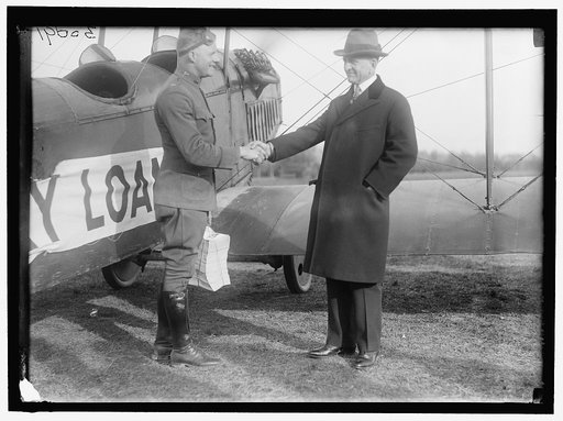 LIBERTY LOANS. CARTER GLASS GIVING VICTORY LOAN CIRCULARS TO LT. BENJAMIN TO DISTRIBUTE BY AIRPLANE