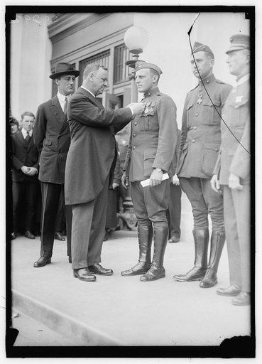 DANIELS, JOSEPHUS. SECRETARY OF THE NAVY, 1913-1921. DECORATING MARINE HEROES