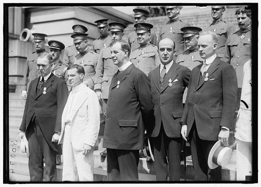 MEDALS, DECORATIONS, ETC. DR. MOTT; SEC. BAKER; FATHER JOHN BURKE; UNIDENTIFIED. OTHER ROWS ARE ARMY CHAPLAINS DECORATED