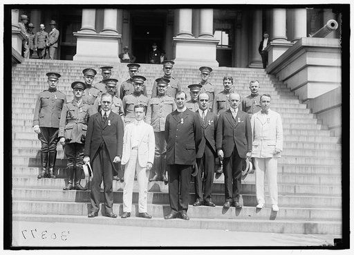 MEDALS, DECORATIONS, ETC. DR. MOTT; SEC. BAKER; FATHER JOHN BURKE; UNIDENTIFIED. OTHER ROWS ARE ARMY CHAPLAINS DECORATED