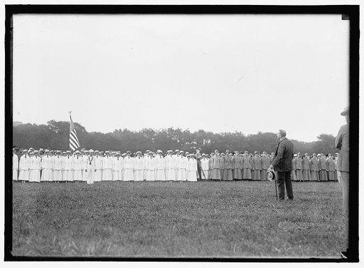DANIELS, JOSEPHUS. SECRETARY OF THE NAVY, 1913-1921. REVIEWING YEOMAN (F) BEFORE THEIR DISMISSAL