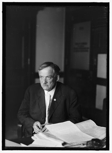 PLUMB, GLENN EDWARD. LAWYER. AT DESK