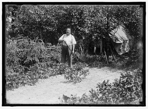 HALLOWAY, E.T. WORKING IN GARDEN
