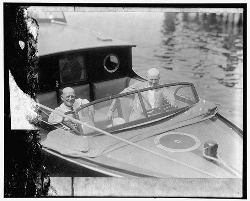 Colonel H.P. Sheldon, U.S. Game Commissioner, and Hon. R.W. Dunlap, Assist. Secretary of Agriculture, aboard the new speedboat recently purchased by the Department of Agriculture for use in enforcing the migratory bird law in the Potomac River. The boat is fully equipped, and will run 30 miles an ho