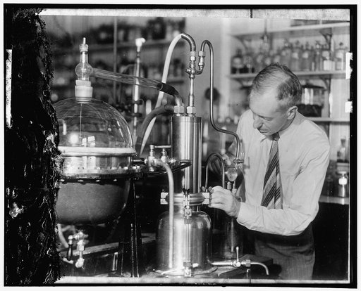 Studying why fruits taste that way. E.K. Nelson of the Department of Agriculture is shown making tests with an apparatus which the Department imported from Germany for the purpose of studying the essential oils or "flavor-giving" content of fruits and vegetables. At present chemists are acquainted w
