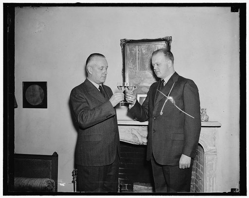 Finland drinks a toast. Washington, D.C., Dec. 15. Open House was the order of the day today at the Legation of Finland here. Toasts were drunk to the health of their President Pehr Evind Svinhufvudt [Svinhufvud], who is celebrating his 75th birthday today; Finland also paid her war debt installment