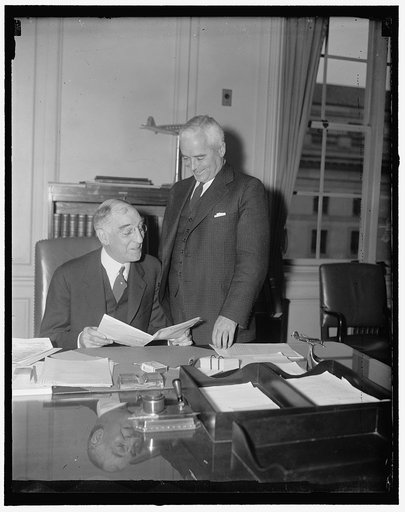 I.C.C. gets new Chairman for 1937. Washington, D.C., Dec. 29. Carroll Miller (left) is the new Chairman of the Interstate Commerce Commission for 1937. A new chairman has been elected every year since the order of succession was adopted January 13, 1911. Charles D. Mahaffie, (right) is the retiring 