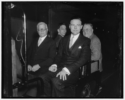 Baby member of the Senate takes subway. Washington, D.C., Jan. 5. Senator Henry Cabot Lodge, Jr., Republican and second youngest member of the 75th session, boards the subway from the Senate Office building to the Capitol to attend his first session