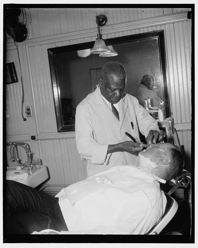 Senatorial shave. Washington, D.C., Jan. 6. Senator Fred H. Brown, new Democratic Senator from New Hampshire, gets a last minute shave before going in the House chamber to hear President Roosevelt address the joint session