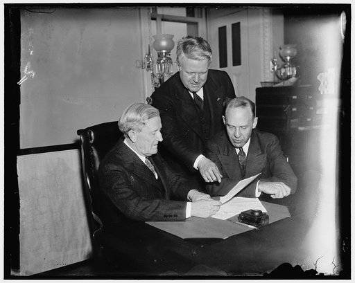 Sponsors of bill to prevent war profiteering meet with American Legion representative. Washington, D.C., Jan. 7. Senator Morris Shappard, left and Rep. Lister Hill, right, Chairman of the Senate and House committees on military affairs, said today they would press for earliest action on their war pr