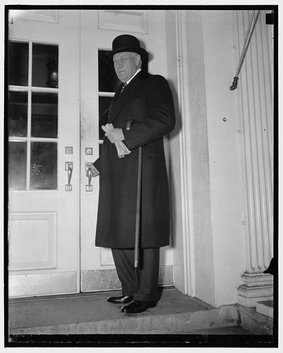 Steel Board head call on Pres. Washington, D.C., Jan. 8. Myron C. Taylor, Chairman of the Board of the U.S. Steel Corporation is shown entering the door of the Executive Office where he supposedly talked with the President concerning the automobile strike, although on leaving he said we talked thing