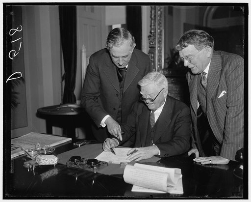 Garner finally signs neutrality bill. Washington, D.C., Jan. 8. Finally the Vice President signed the Neutrality Bill that has been hanging fire for the last few days because of the shipments all ready to go to Spain through some parlimentary tie-up the Vice-President had to wait 24 hours before he 
