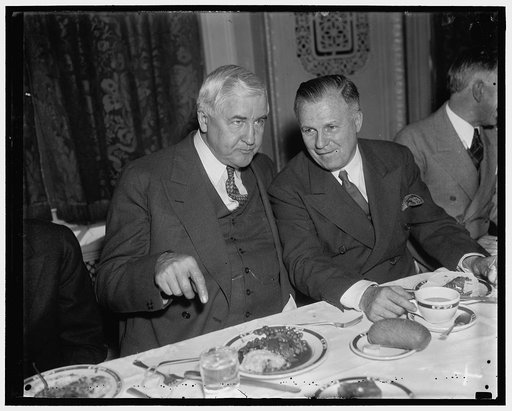 At Rayburn luncheon. Washington, D.C., Jan. 9. No doubt, this conversation was along monetary lines: Jesse Jones, Chairman of the R.F.C. and J.F.T. O'Connor, Comptroller of the Currency, as they attended the luncheon given in honor of Rep. Sam Rayburn, new Majority Leader of the House. The Texas Clu