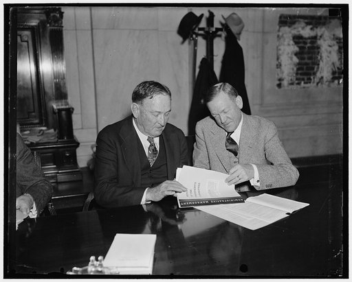 Senate majority and minority leaders. Washington, D.C. Jan 14. Senator Joseph T. Robinson, (left) Democratic Majority Leader, and Senator Charles L. McNary, Republican Minority Leader, went into a huddle today to discuss plans for speedy action on the many bills to be introduced in the Senate during
