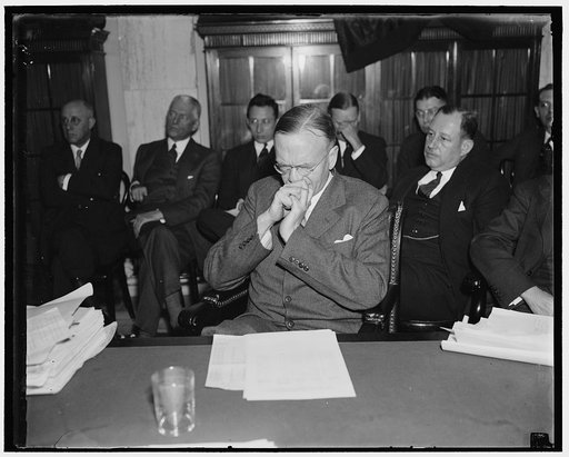 Now let me think. Washington, D.C. Jan. 15. Francis Ward Paine, Senior Partner in Paine, Weber and Company, Boston and New York brokers in a moment of concentration before answering one of the questions that was fired at him by Sen. Wheeler at the railroad hearing at the Capitol today