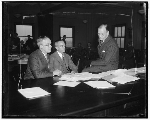 Buffalo bankers before S.E.C. Washington, D.C. Jan. 17. The bankers from Buffalo, New York are shown in a huddle during a recess when they were testifying before the Securities and Exchange today. Left to right: Perry E. Wurst, Executive Vice-President of the Manufactures & Traders Trust Co.; Lewis 