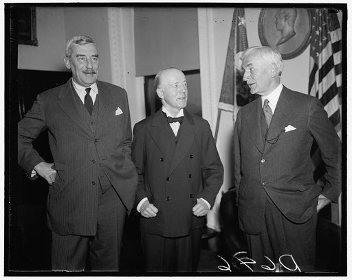 British trade head and hull. Washington D.C. The President of the British Board of Trade is received by Secretary of State Hull before the trade official left to spend the weekend at the White House. Left to right: Sir Ronald Lindsay the British Ambassador who presented Walter Runciman to Secretary 