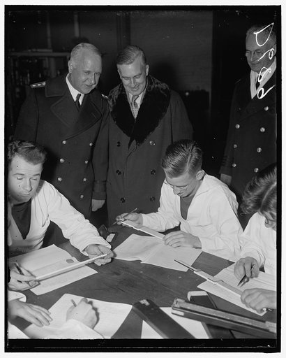 New Assistant Secretary of Navy pays first official visit to Naval Academy. Annapolis, Md. Assistant Secretary of the Navy Charles Edison paid his first official visit to the United States Naval Academy today. He is shown with Rear Admiral David F. Sellers, Commandant of the Academy, as they watched