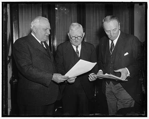 Scan president's message on Judiciary. Washington D.C. No President's message in years has created the interest the one President Roosevelt sent to Congress today, demanding an overhauling of the Judiciary. Vice President Garner (center) with Senator William H. Dietrich (left) of Illinois; and Senat