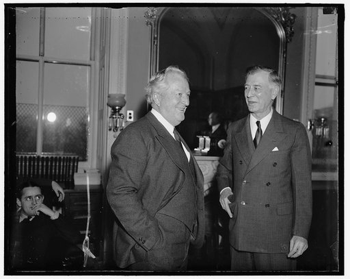 Nevada's Senators. Washington D.C. Senator Pat McCarran and Senator Key Pittman, (right) both Democrats from Nevada, exchanging opinions on President Roosevelt's proposal that the membership of the Supreme Court be increased to possibly 15 members. They are pictured as they attended a meeting of the