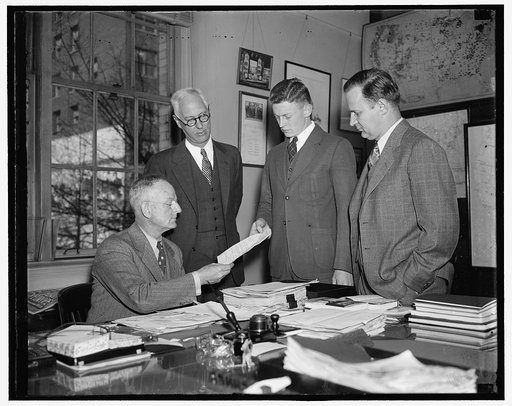 First CCC appointed to Civil Service rolls received by Director Fechner. Washington D.C. March 3. Elbert Jackson Lester, the first CCC enrollee to be appointed to the recently created civil service position of junior assistant to technician, was today presented to Robert Fechner, Director of the Civ