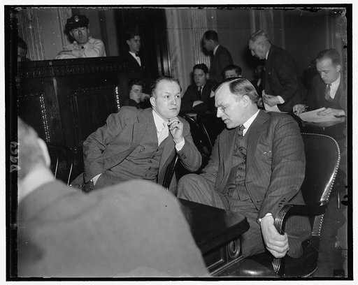 G. O'Berdick, left, Secy. to Young & John W. Young, Pres. of Federal Laboratories both domestic & for foreign markets tear gas, submachine guns, armored shields, cars & vests. At Civil Liberties Comm. hearings