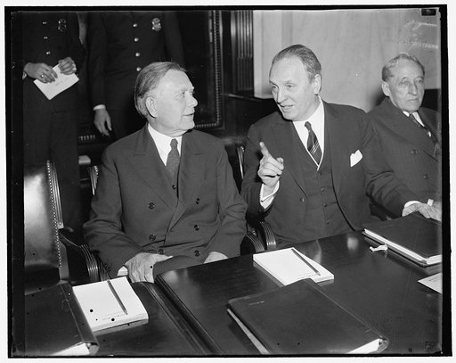As hearing on president's re-organization plan opened today. Washington, D.C., March 10. Senator Henry F. Ashurst (right) Democrat of Arizona and Chairman of the Senate Judiciary Committee, discusses last-minute details with Senator William E. Borah, of Idaho, as hearings opened today on President R