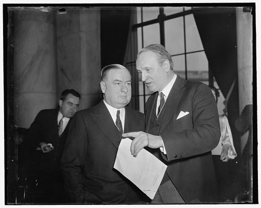 Assistant to Cummings checks up. Washington, D.C., March 12. Joseph D. Keenan, Ass't to the Attorney General is a daily visitor at the Senate Judiciary hearing on the Supreme Court issue. He is shown with the Chairman of the Committee Sen. Henry F. Ashurst, of Arizona [...