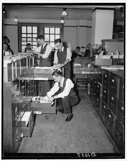 Clerks at the Reconstruction Finance Corporation checking records