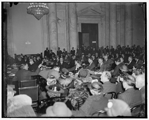 Judiciary hearing packed with spectators. Washington, D.C. March 22. While Senator Wheeler took the stand today, people had to be turned away from the hearing room as even the standing room was taken. It is still the biggest attraction on the hill. Photo shows the crowded hearing room with the Senat